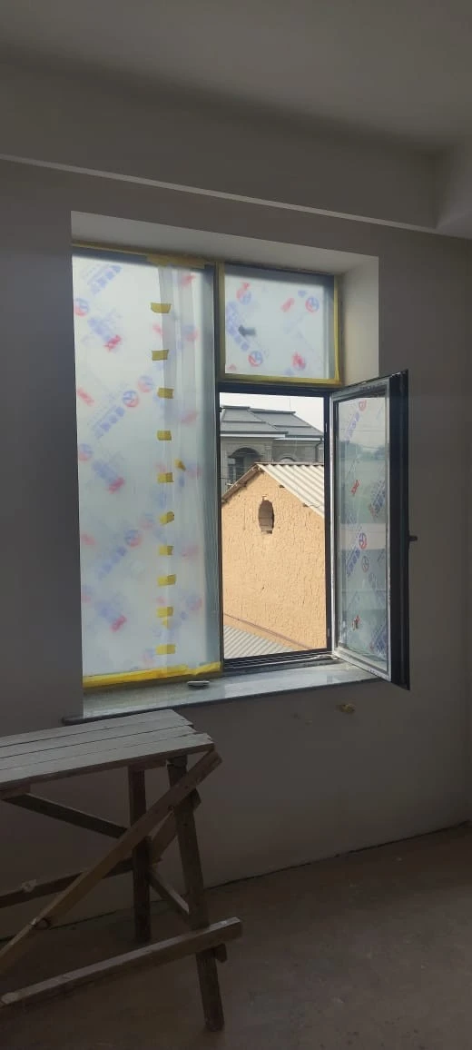 Customer and neighbours viewing 93 Series aluminium windows at a home project in Zafar, Tashkent