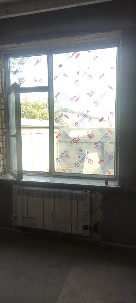 Customer and neighbours viewing 93 Series aluminium windows at a home project in Zafar, Tashkent
