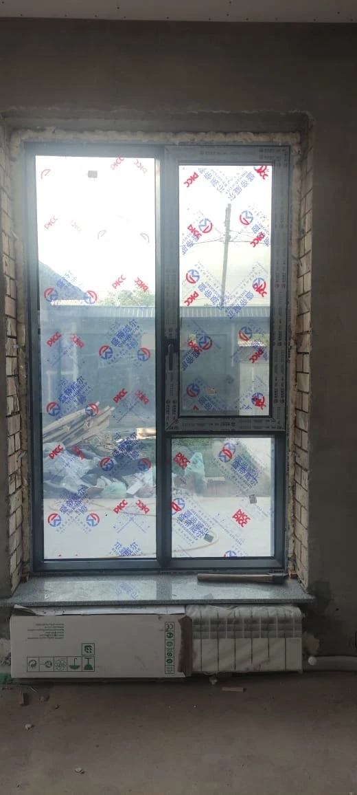 Customer and neighbours viewing 93 Series aluminium windows at a home project in Zafar, Tashkent
