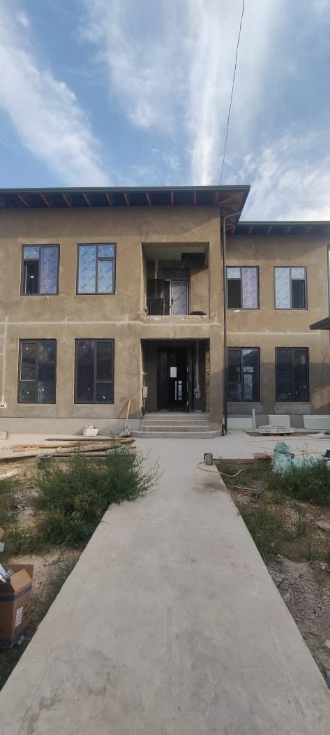 Customer and neighbours viewing 93 Series aluminium windows at a home project in Zafar, Tashkent