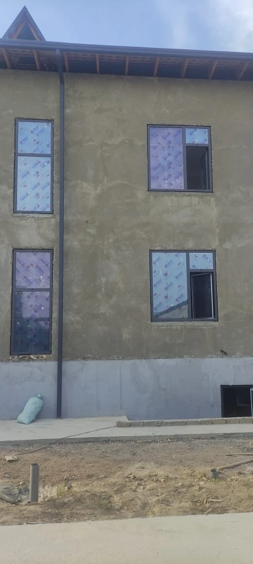 Customer and neighbours viewing 93 Series aluminium windows at a home project in Zafar, Tashkent